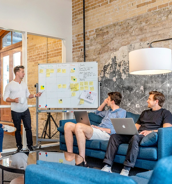 Startup team planning growth strategy on a whiteboard — Protea Consulting financial readiness