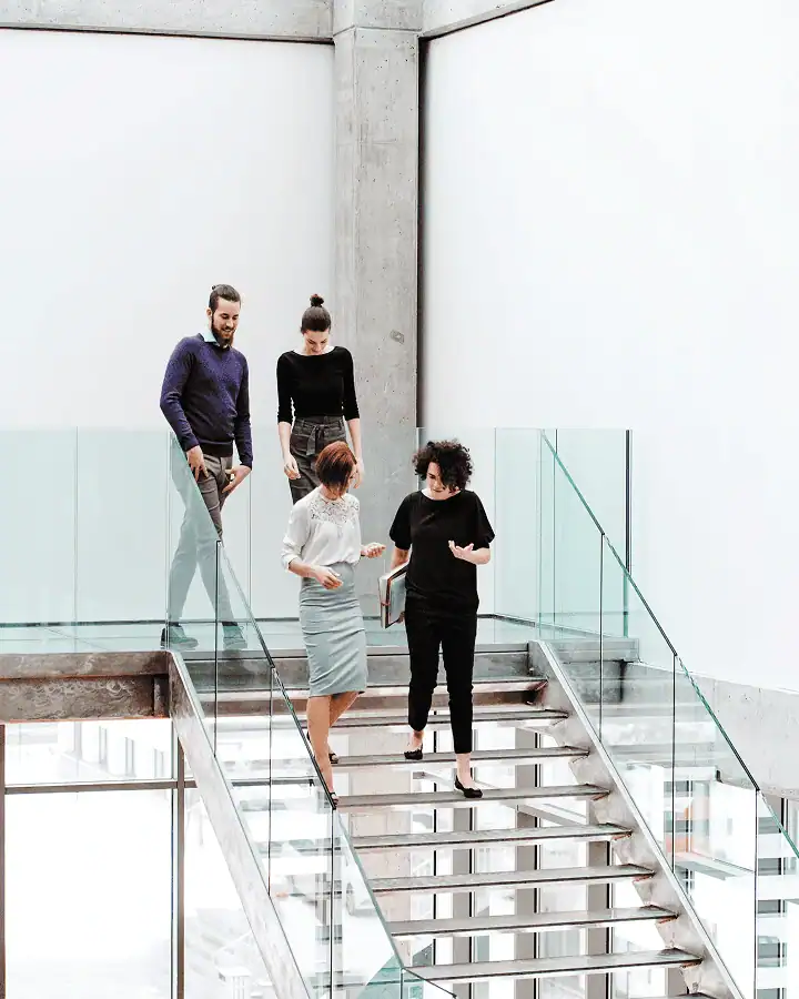 Leadership team walking together in modern office — scaling company growth strategy