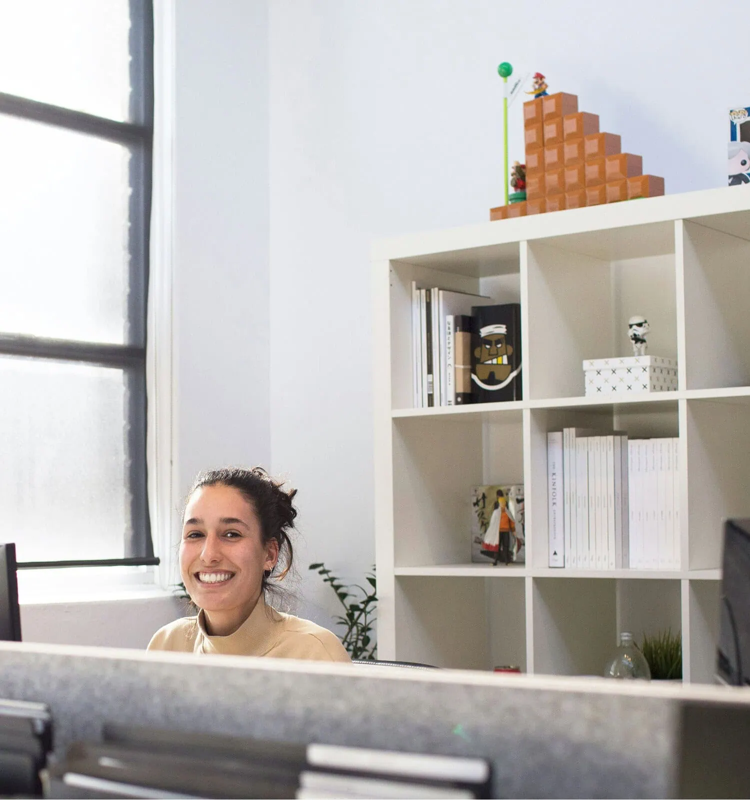 Professional working at desk in a bright office representing business consulting environment