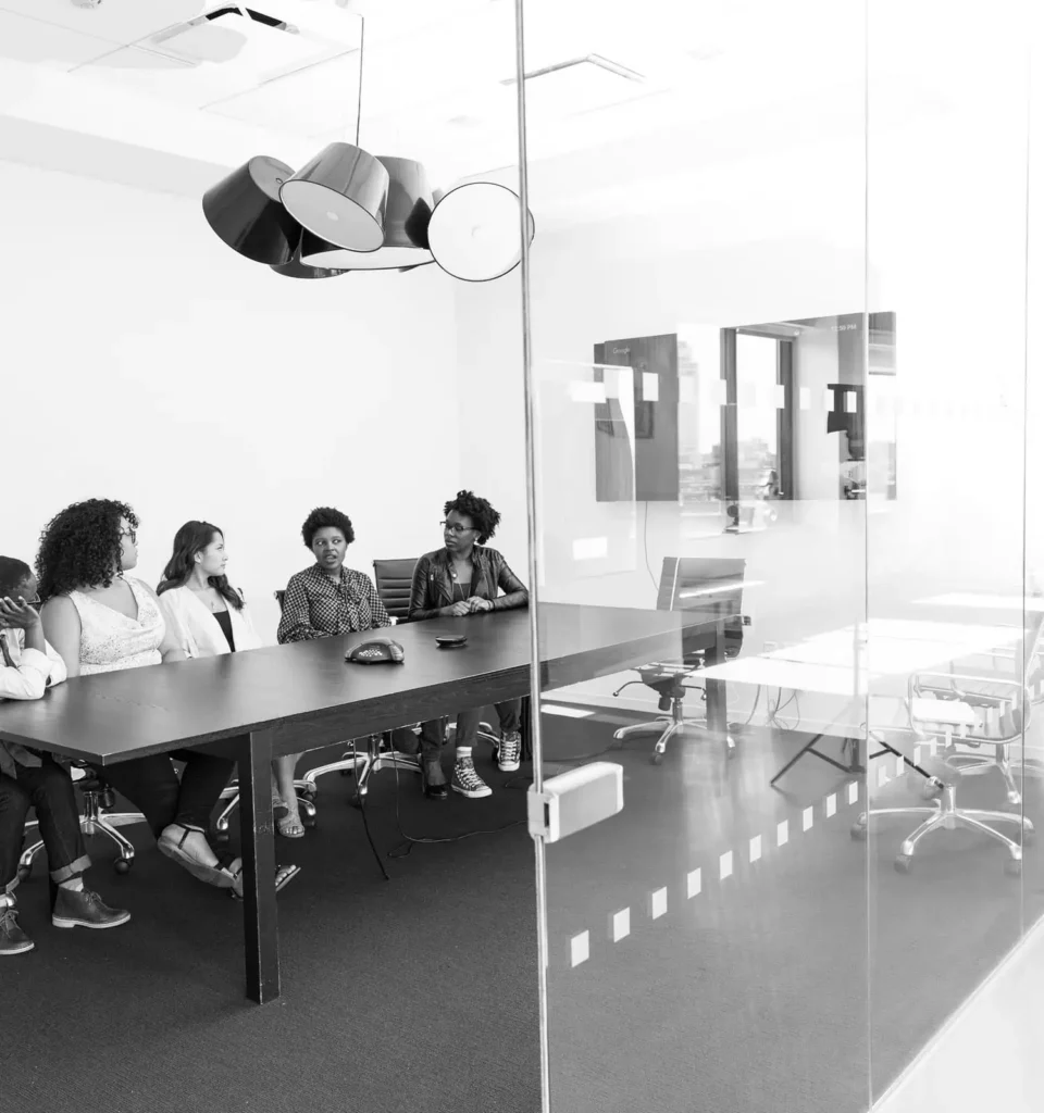 Executive team in boardroom discussing financial strategy and operational complexity in a scaling company