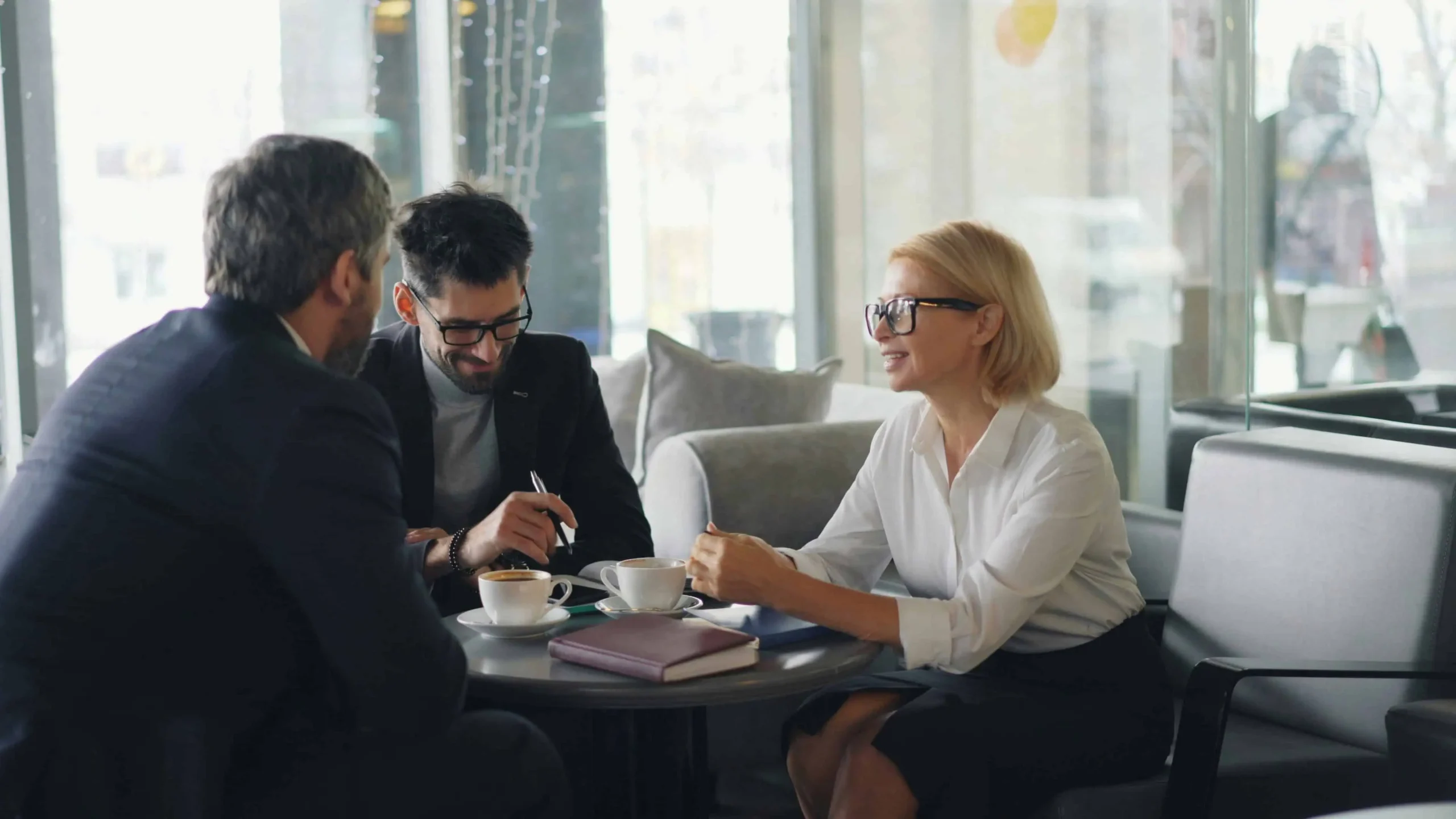 Business consultants in a strategic advisory meeting over coffee
