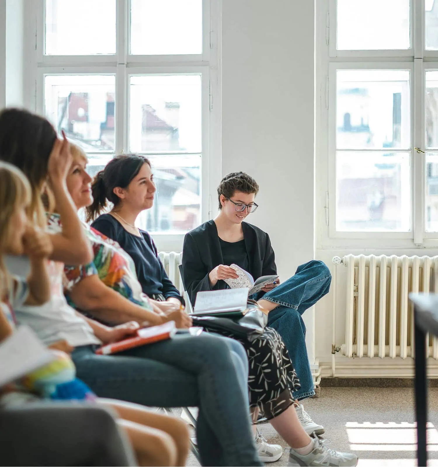 Audience listening attentively during a financial presentation