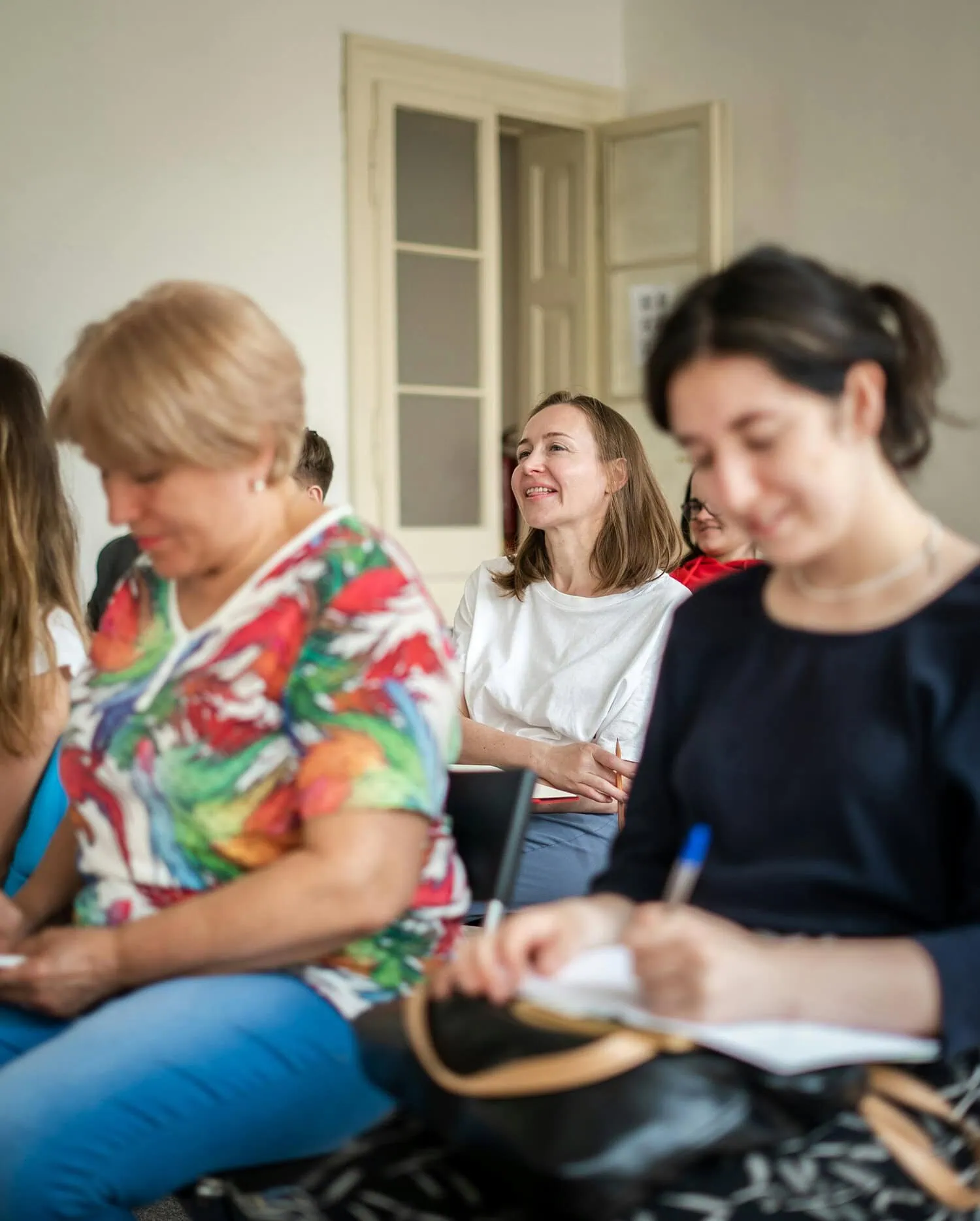 Business team listening and taking notes during a financial leadership session